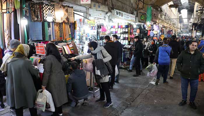 Iranians walk through Tehran Bazaar, in Tehran, Iran December 25, 2022. — Reuters