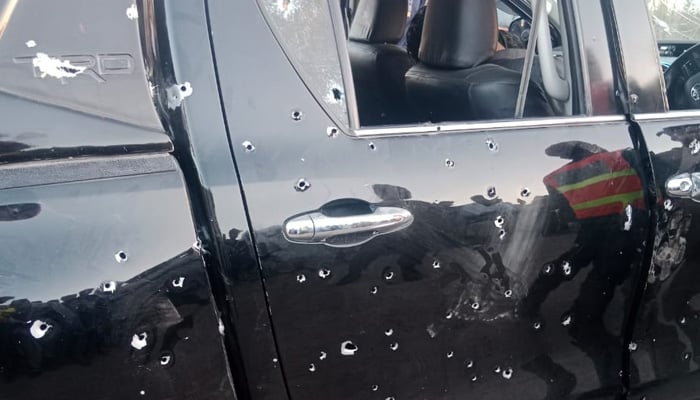 Bullet marks can be seen on the car after firing by unidentified assailants in Gujrat, Punjab, on March 2, 2025. — Reporter