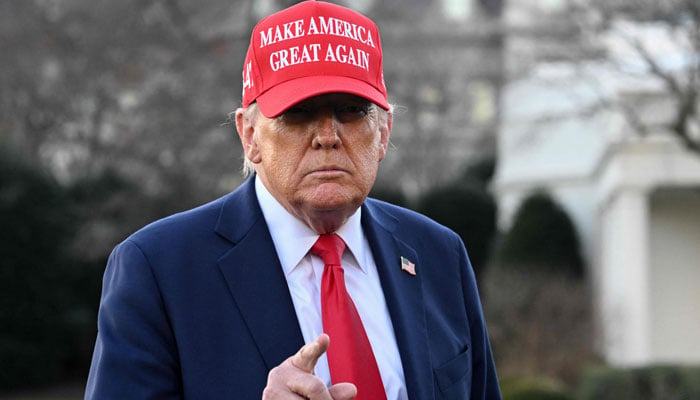 US President Donald Trump points out when he speaks to journalists while preparing to leave the White House in Washington, DC, February 28, 2025. - AFP