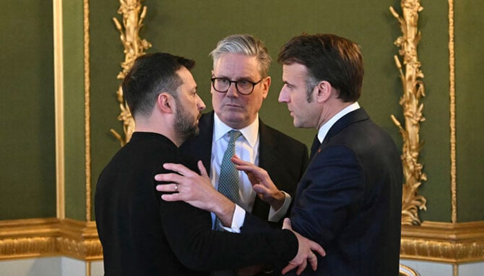 Britains Prime Minister Keir Starmer (center) Ukraines President Volodymyr Zelenskyy (left) and Frances President Emmanuel Macron meet during the European leaders summit to discuss Ukraine at Lancaster House, London, on March 2, 2025. — AFP