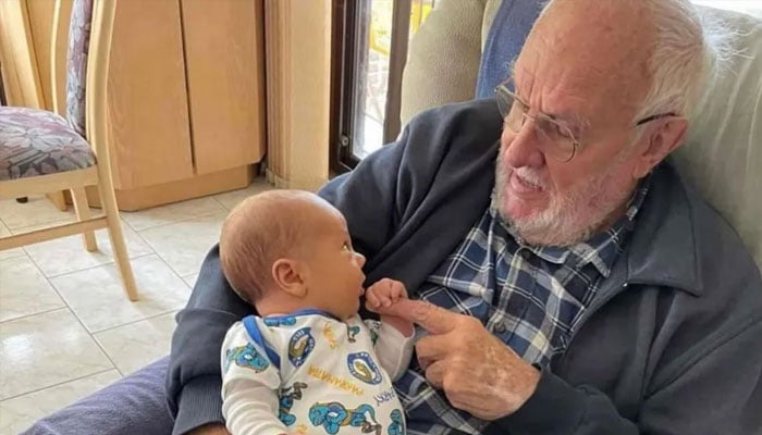 James Harrison with his grandson, Trey, in an earlier picture.— Australian Red Cross Lifeblood/File