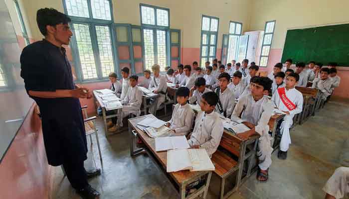 A teacher and students in a Pakistani classroom. — Reuters/File