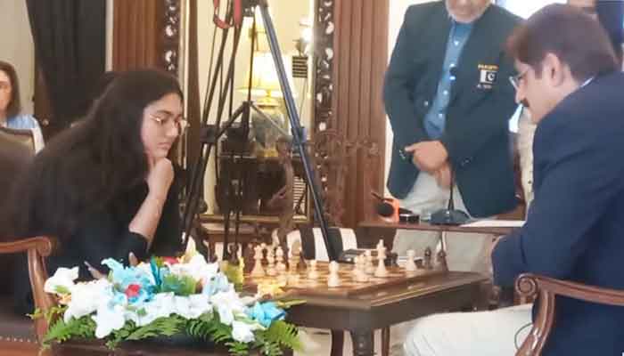 National junior chess champion Mehak Maqbool (left) and Sindh Chief Minister Murad Ali Shah playing a chess match in Karachi, on March 1, 2025. — YouTube/@SindhCMHouse