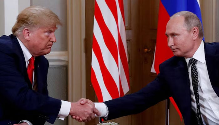 US President Donald Trump and Russian President Vladimir Putin shake hands as they meet in Helsinki, Finland, July 16, 2018. — Reuters