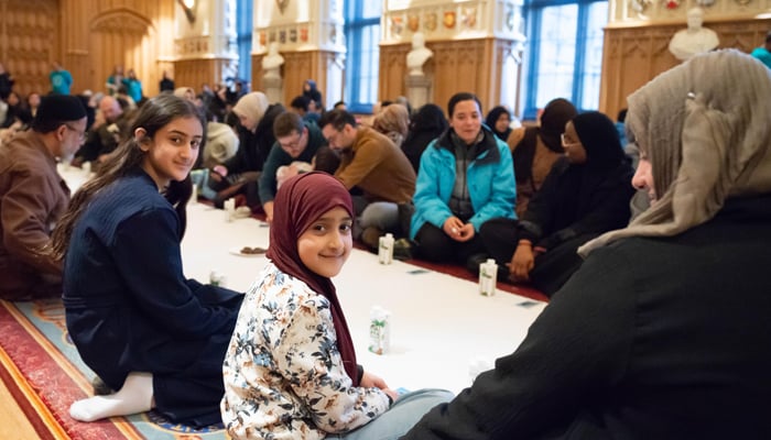 Children gesture as they attend the first-ever open iftar inside Windsor Castles State Apartments. — Reporter