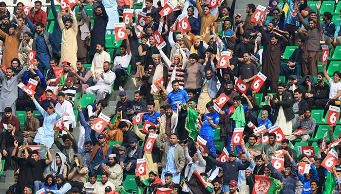 Fans cheer while watching the ICC Champions Trophy one-day international (ODI) cricket match between Afghanistan and England at the Gaddafi Stadium in Lahore on February 26, 2025. — Reuters