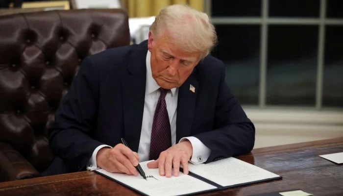 US President Donald Trump signs documents as he issues executive orders and pardons for January 6 defendants in the Oval Office at the White House on Inauguration Day in Washington, US, January 20, 2025. — Reuters