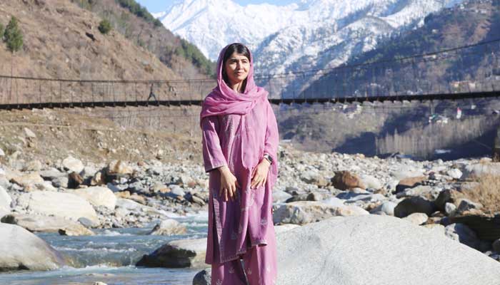 Nobel Peace Prix Laureat and Education Activist Malala Yousafzai poses for a photo in Riverside in his native village Barkana, Shangla District, Khyber Pakhtunkhwa, March 5, 2025. - X / @ Malalaa