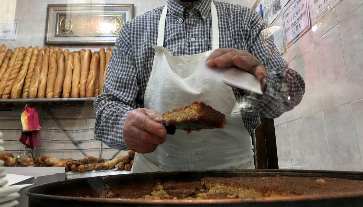 Ismail Hasnaoui, owner of the Ali Bouzid bakery, prepares Qalb al-Louz, traditional Algerian sweets, during Ramadan, in the old city of Algiers, Algeria April 25, 2021. — Reuters