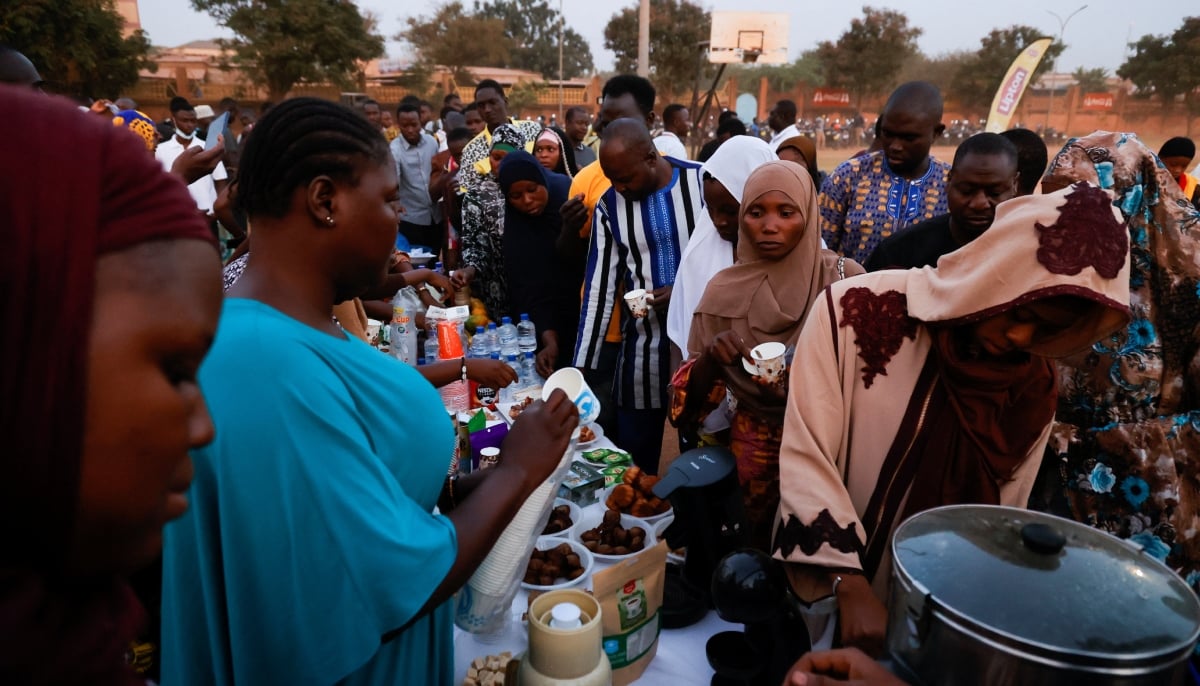 Burkinabe Muslims and Christians gather to break the fast together in hopes of promoting religious tolerance during the Ramadan in Ouagadougou’s public square, Burkina Faso March 31, 2023. — Reuters