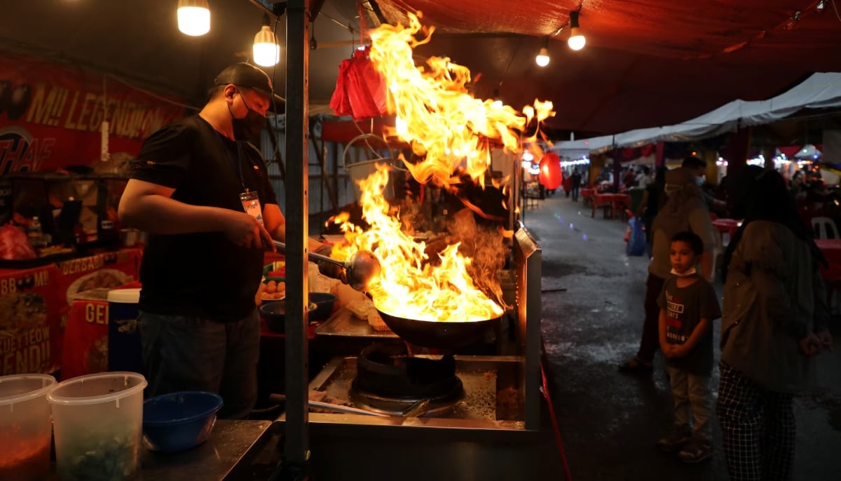 A vendor prepares food at a Ramadan bazaar in Kuala Lumpur, Malaysia May 4, 2021. — Reuters