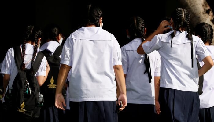 Thai girls walk inside a school wearing school uniforms that are mandatory in the country, in Bangkok, Thailand September 15, 2020. — Reuters