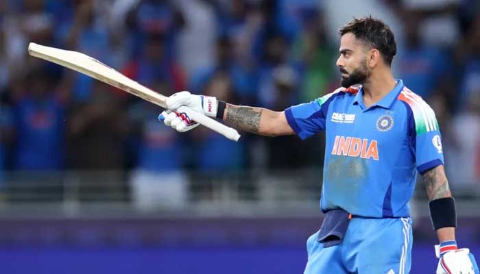 Indias Virat Kohli celebrates after hitting four runs to reach his century during ICC Champions Trophy clash against Pakistan, February 23, 2025. — Reuters