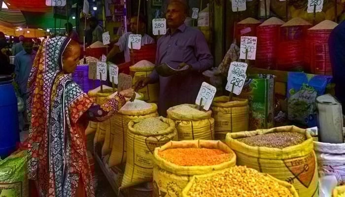 A client buys rice from a big store in Karachi. - AFP / File