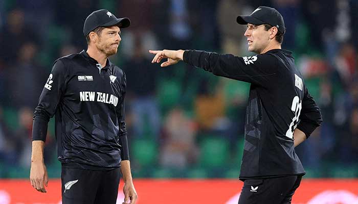 The New Zealandes Mitchell Santrner interacts with Matt Henry during the International Criminal Criminal Champions Cup semi -final against South Africa at Gaddafi Stadium, Lahore, March 5, 2025. - Reuters