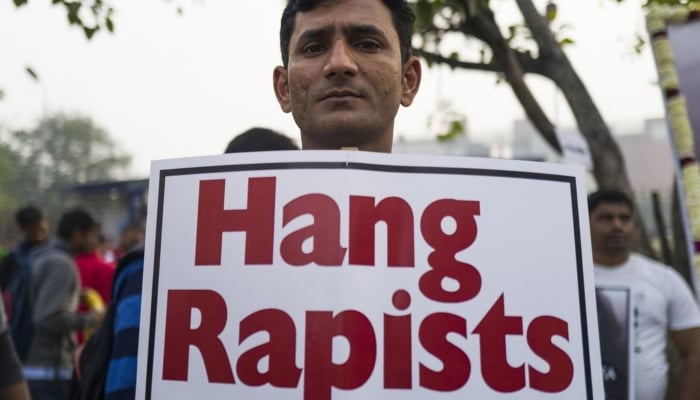 A man in Delhi protests against the rape and murder of a woman in Hyderabad in December 2019. — AFP