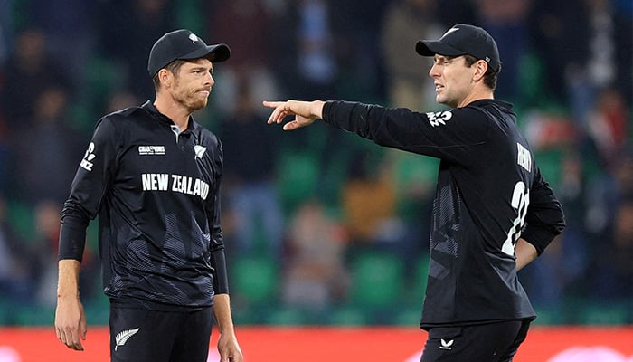 New Zealands Mitchell Santner interacts with Matt Henry during ICC Mens Champions Trophy semi-final against South Africa at Gaddafi Stadium, Lahore, on March 5, 2025. — Reuters