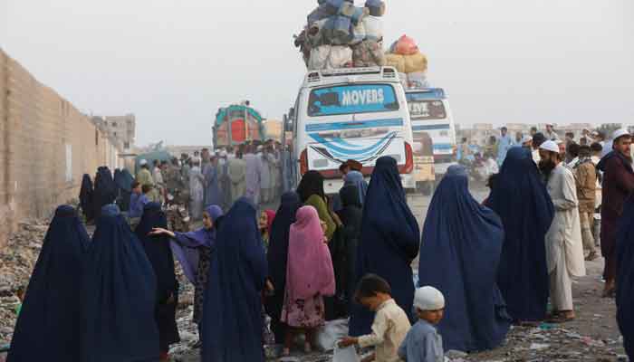 Afghan people gather to board buses as they prepare to return home, after Pakistan gave last warning to undocumented migrants to leave, at a bus stop in Karachi, Pakistan, October 29. — Reuters