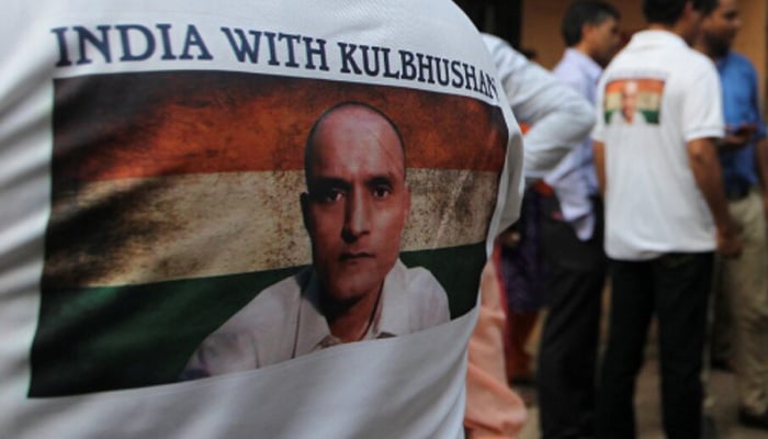 People wait before the issue of a verdict in the case of Indian national Kulbhushan Jadhav by International Court of Justice, in Mumbai, July 17, 2019. — Reuters