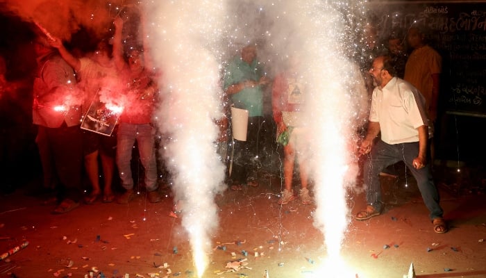 People celebrate after India won the ICC Champions Trophy after defeating New Zealand in the finals, in Ahmedabad, India, on March 9, 2025. — Reuters