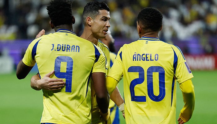 Al Nassrs Jhon Duran celebrates scoring their third goal with Cristiano Ronaldo and Angelo Gabriel in a match against Esteghlal on March 10, 2025. — Reuters