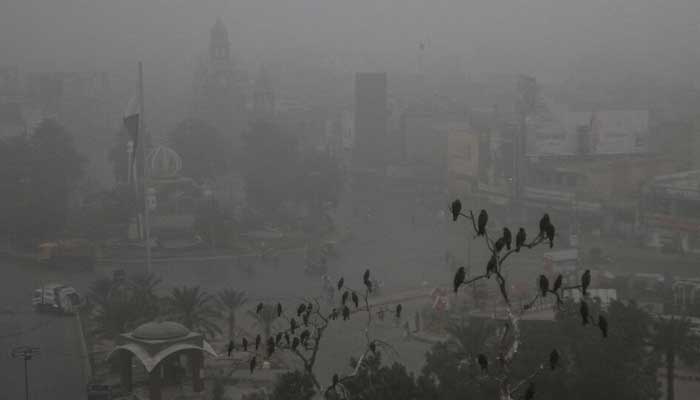 A street is shrouded in smog amid air pollution, during a morning in Multan, November 15, 2024. — Reuters