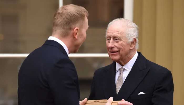 King Charles passes the baton at Buckingham Palace event