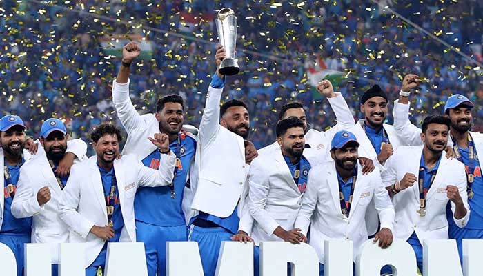 India players with the cup celebrate the platform after winning the ICC Mens Champions at Dubai International Stadium, Dubai, United Arab Emirates, March 9, 2025. - Reuters