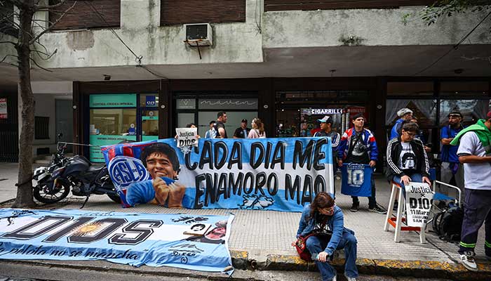 Fans of Argentine football legend Diego Armando Maradona gather, on the day of a court case against people charged with Maradonas death, in Buenos Aires, Argentina, March 11, 2025. — Reuters