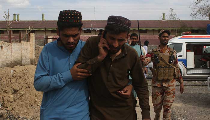 Plain clothes security force perosnnel, who were rescued from a train after it was attacked by militants, leave Mach railway station in Mach, Balochistan, March 12, 2025. — Reuters 