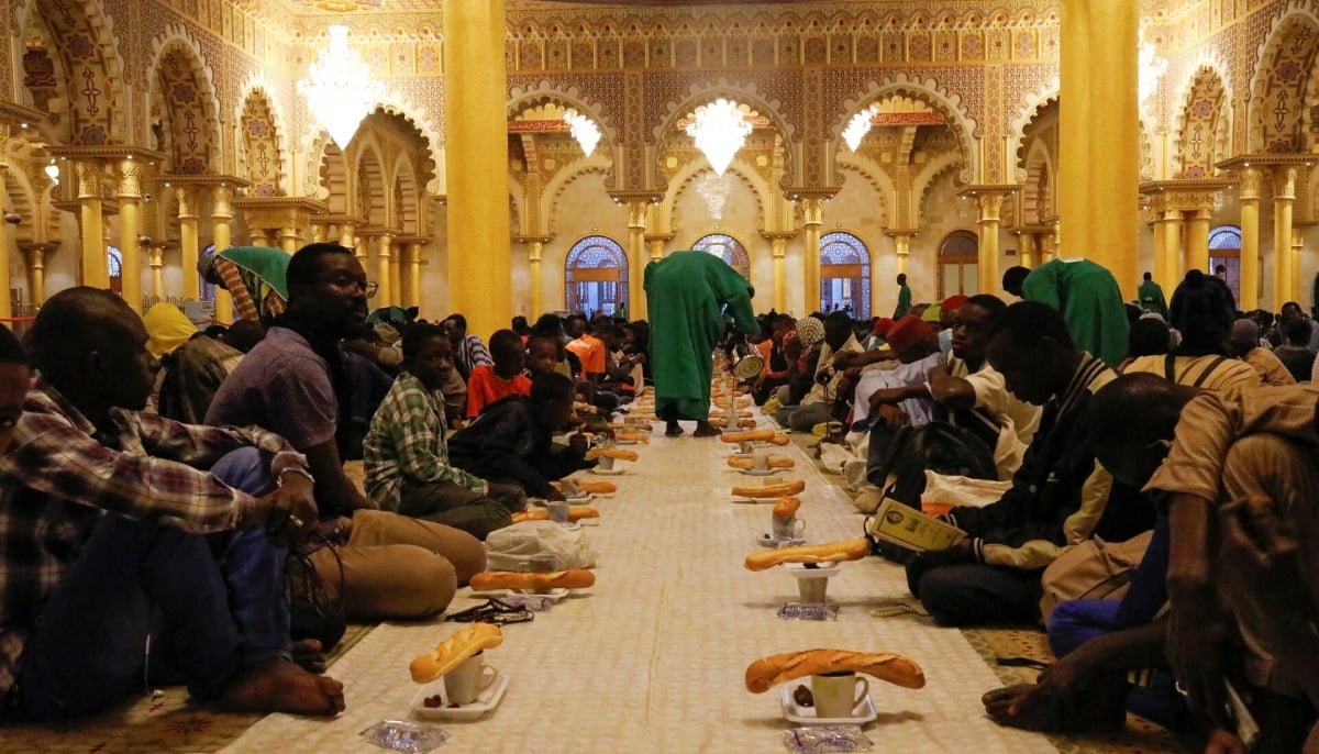 A man prepares food to the faithfuls for the breaking of the Muslim fast during the holy month of Ramadan at La Grande Mosque Moride in Dakar, Senegal April 11, 2022. — Reuters