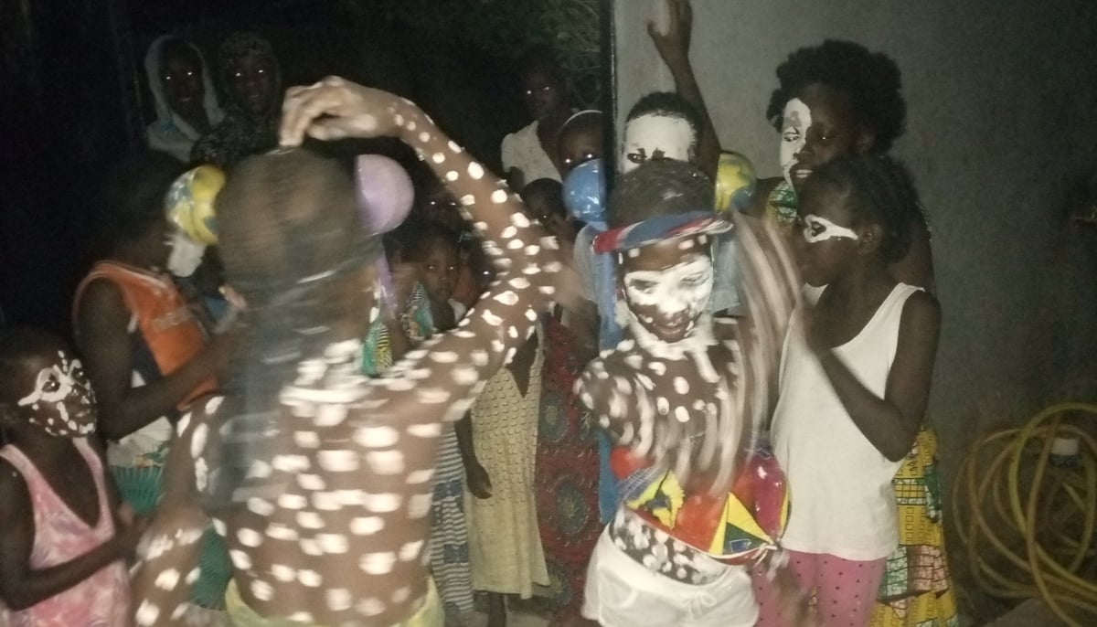 Children with faces covered in traditional painted maska perform Yogoro and Salawalé in Mali. — Mali Rising Foundation/File