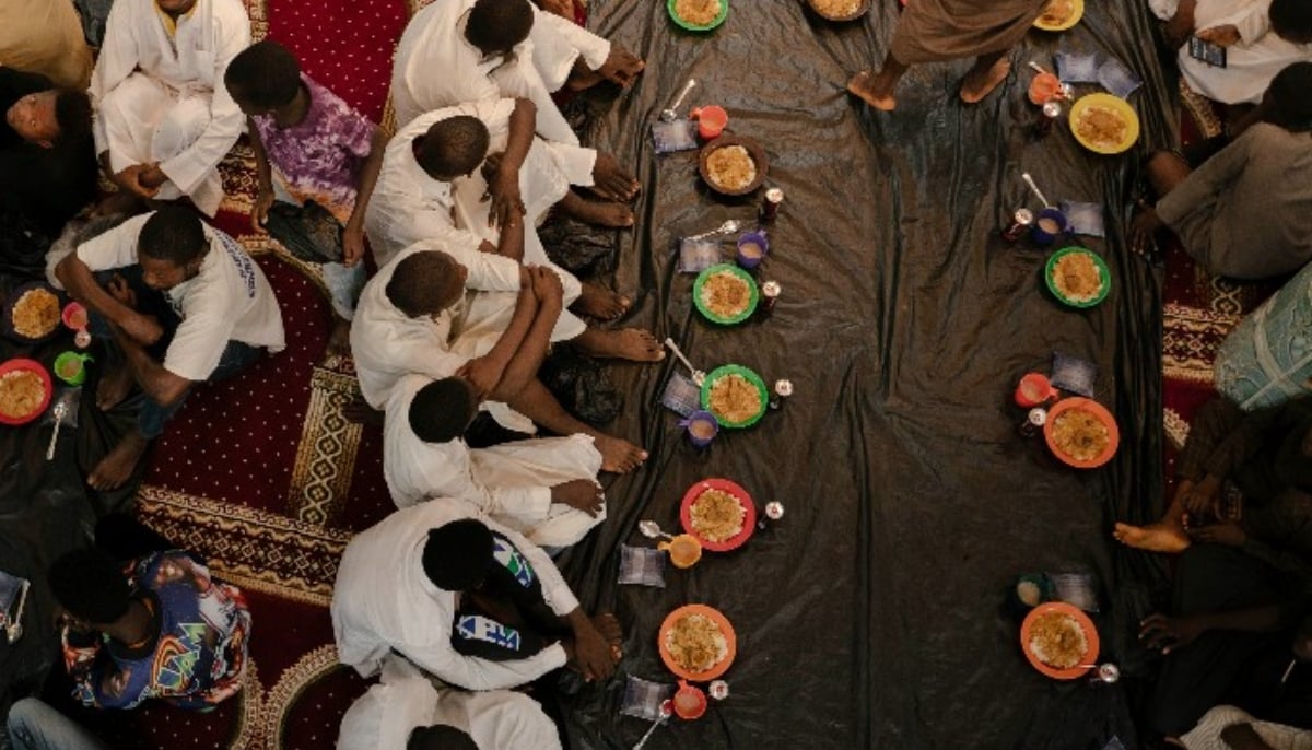 People in Sierra Leones capital of Freetown sitting together and waiting to break the fast during Ramadan. — AFP/File