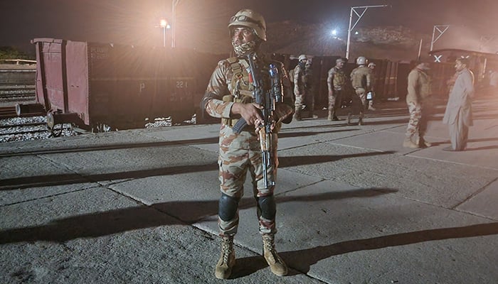 Pakistani soldiers secure Mach railway station after security forces freed nearly 80 passengers following a security operation against armed militants in Mach, Balochistan on March 11, 2025. — AFP