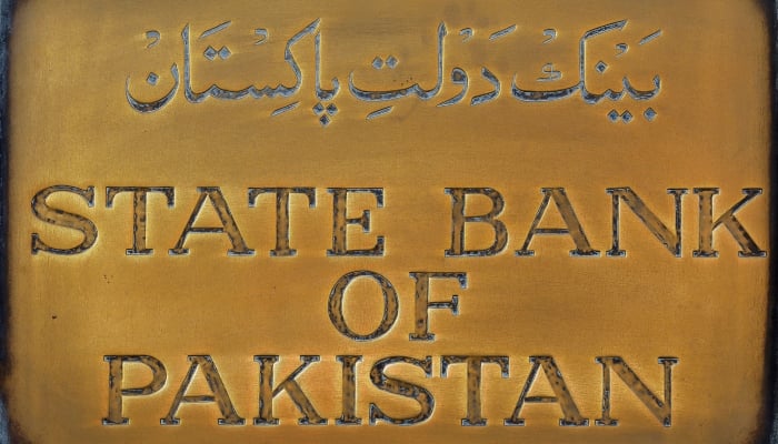 A brass plate from the State Bank of Pakistan is seen outside of its wall in Karachi, Pakistan, December 5, 2018 - Reuters