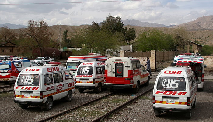 Ambulances are parked outside a railway station where rescued and injured passengers of a train attacked by militants are brought, in Mach, Balochistan, Pakistan, March 12, 2025. — Reuters