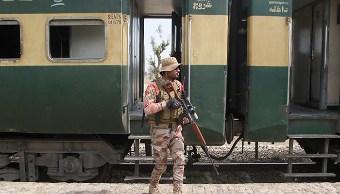 A Pakistan Army soldier walks next to a rescue train, after the attack on a train by militants in Bolan, at the railway station in Mushkaf, Balochistan, Pakistan, March 12, 2025. — Reuters