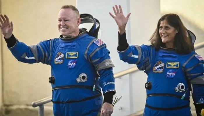 Barry Wilmore (L) and Sunita Williams waving moments before they boarded the Boein Starliner capsule for an eight-day mission at the Cape Canaveral, Florida, on June 5, 2024. — AFP