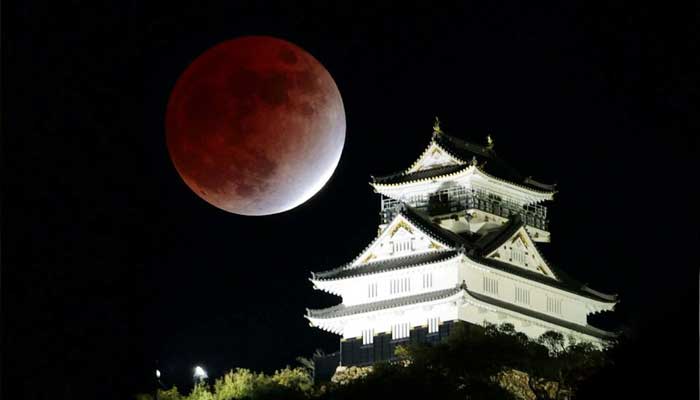 A partial lunar eclipse is observed over Gifu Castle in Gifu, central Japan November 19, 2021. — Reuters