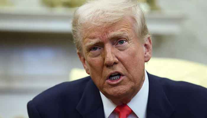 US President Donald Trump reacts while he meets the Irish Taoiseach (Prime Minister) Micheal Martin (not in the photo), in the oval office of the White House in Washington, DC, United States, March 12, 2025. - Reuters