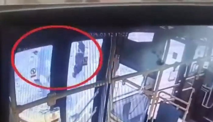 A CCTV footage showing armed men looting Peoples Bus Service employees. — Screengrab via Geo News