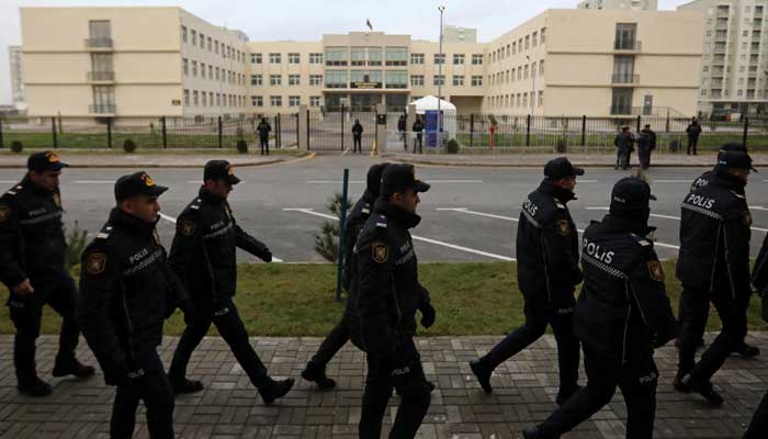 Police officers walk outside a courthouse on the day of the trial of former political figures and officials of the breakaway region of Nagorno-Karabakh, accused of various charges, including genocide and war crimes, in Baku, Azerbaijan January 17, 2025. — Reuters