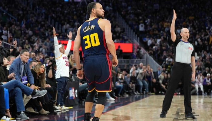 Stephen Curry #30 of the Golden State Warriors watches his shot go through the net has he makes his 4000th career three-pointer against the Sacramento Kings during the third quarter at Chase Center on March 13, 2025 in San Francisco, California. — AFP