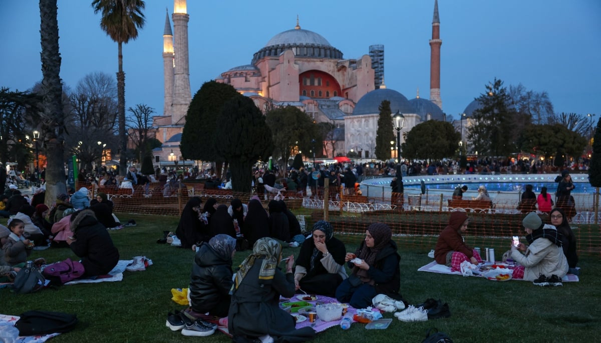 People have their iftar meal at Sultanahmet Square during the holy month of Ramadan, with the Hagia Sophia Grand Mosque in the background, in Istanbul, Turkiye March 1, 2025. — Reuters