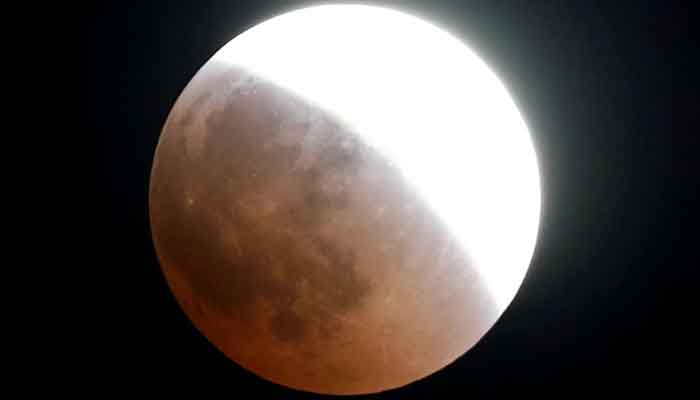 A blood moon rises during a lunar eclipse over Cairo, Egypt. — Reuters/File