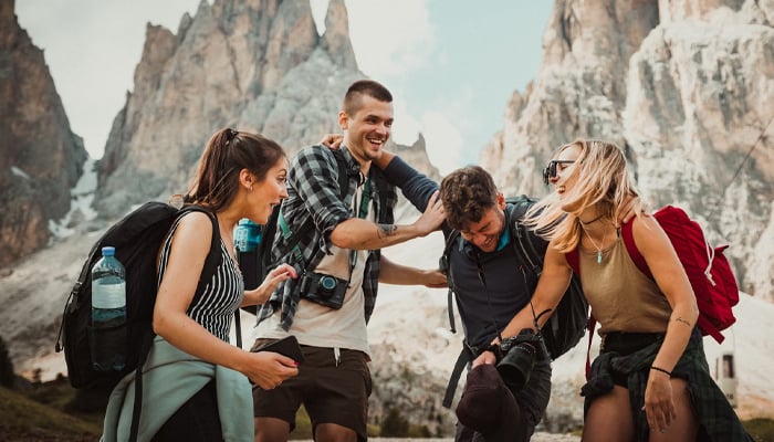 A representational image of a group of friends in a mountainous area. — Unsplash/File