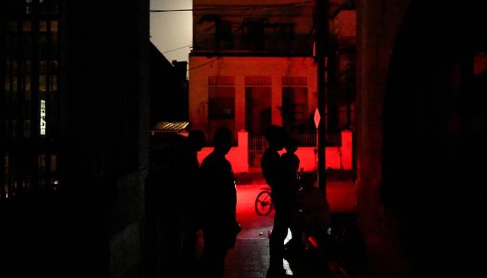 People gather in a neighbourhood during a national electrical grid collapse in Havana, Cuba, March 14, 2025. — Reuters