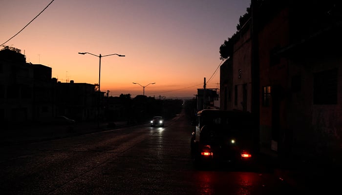 Cars drive on a street during a national electrical grid collapse, in Havana, Cuba, March 15, 2025. — Reuters