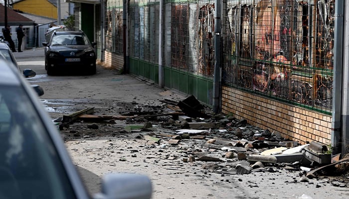 Debris lies on the pavement outside the burnt down nightclub in which revellers died, in Kocani, a town some 100 kilometres east of the capital Skopje, on March 16, 2025. — AFP