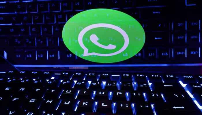 A keyboard is placed in front of a displayed WhatsApp logo in this illustration taken February 21, 2023. — Reuters